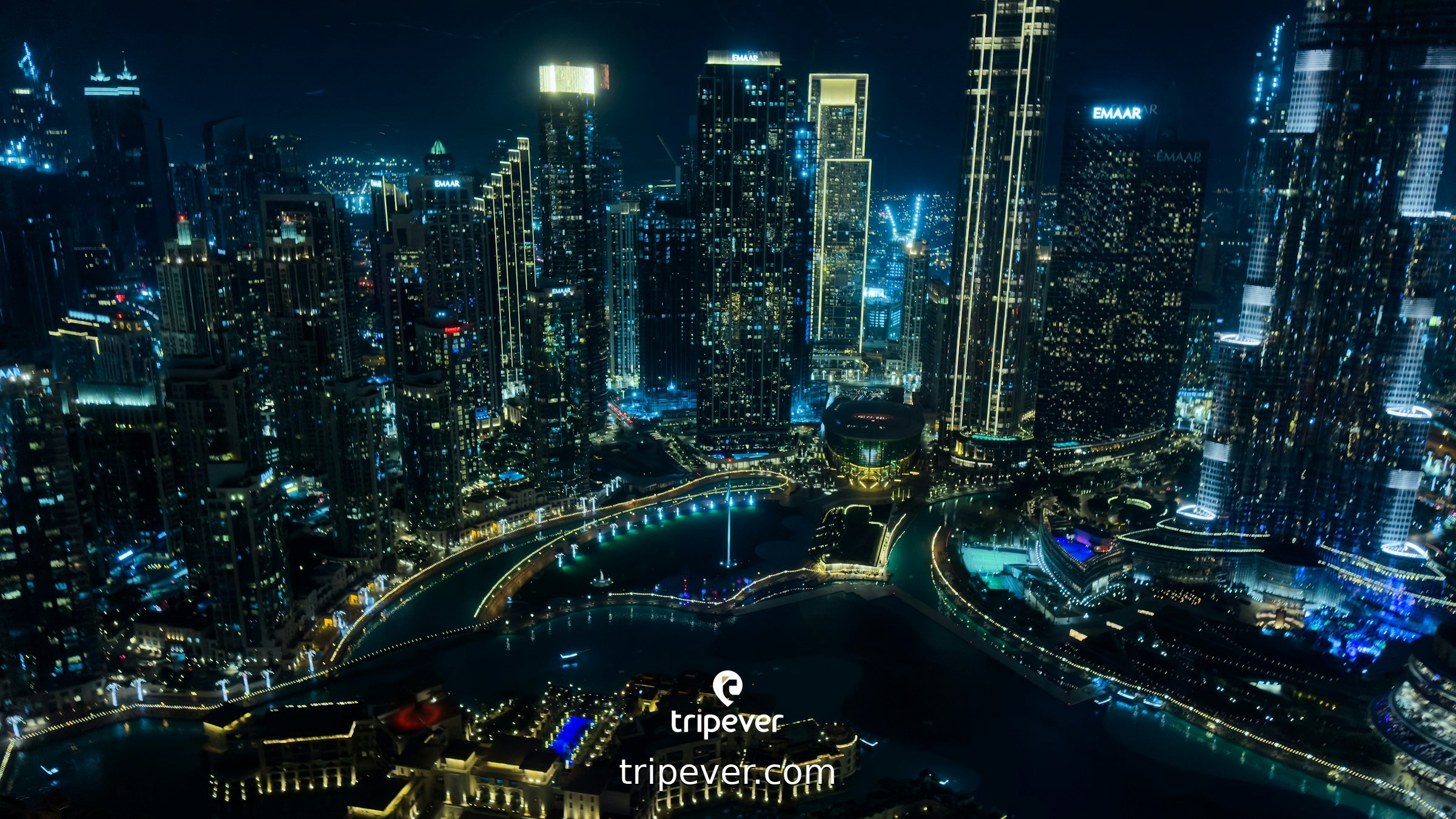 Glistening city skyline at night with illuminated ...
